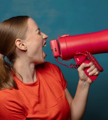 young blonde woman with a megaphone